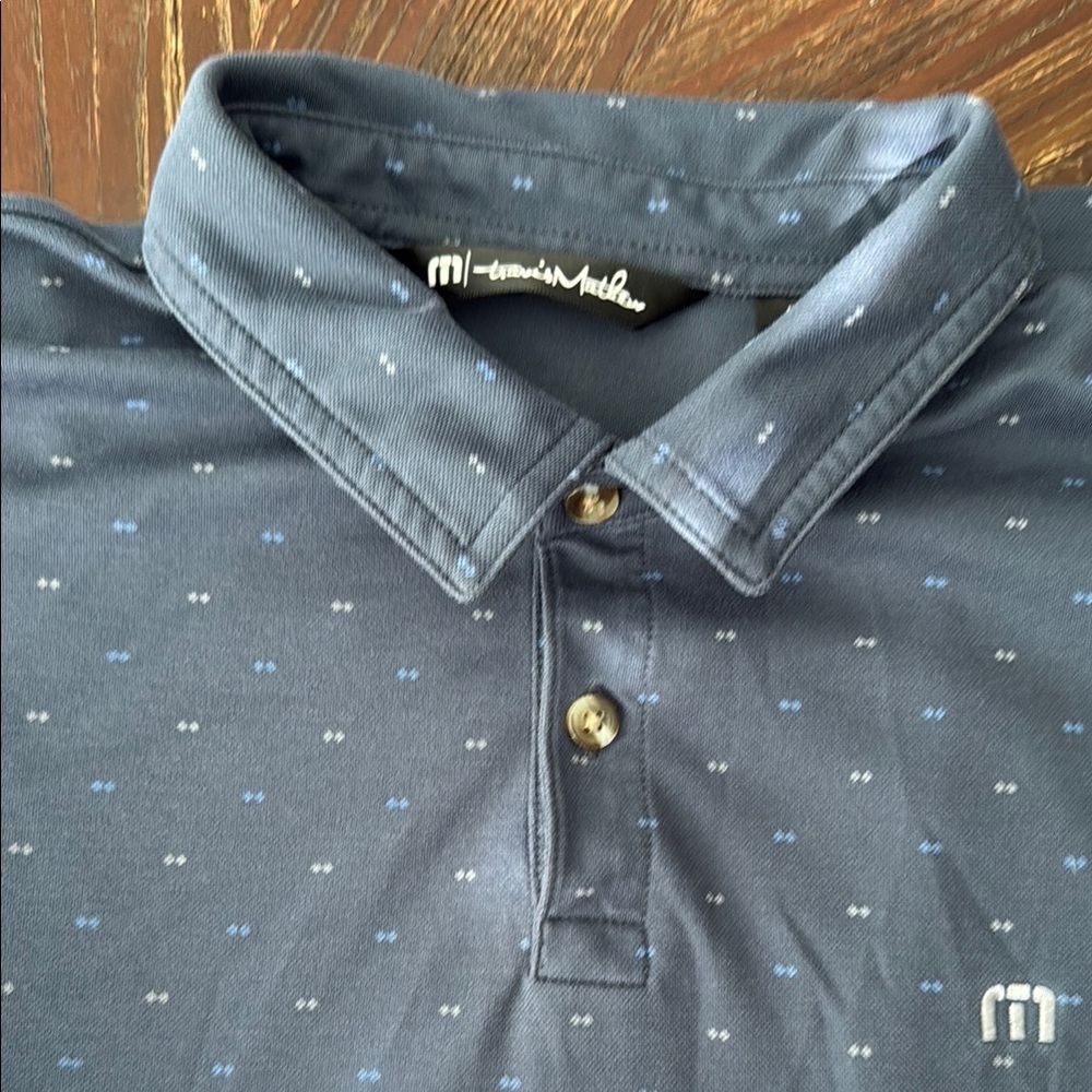 Travis Mathew Blue Polo Shirt with Subtle Pattern